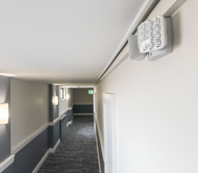emergency lighting in commercial building hallway
